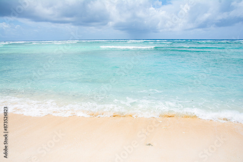 Blue tropic ocean, White beach and waves, east coast of Kayangel island, Palau