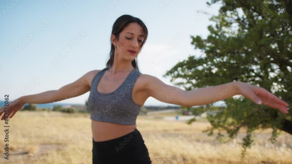 Young Woman Makes Dance Steps In The Natural Peace Of An Outdoor Park Young Woman Makes Dance Steps In The Natural Peace Of An Outdoor Park