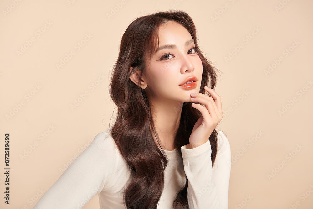 Beautiful young asian woman with clean fresh skin on beige background, Face care, Facial treatment, Cosmetology, beauty and spa, Asian women portrait. Beautiful young asian woman with clean fresh skin on beige background, Face care, Facial treatment, Cosmetology, beauty and spa, Asian women portrait.