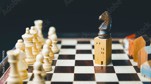 Building and house models in chess game, Business financial district and commercial , success and leadership business concept.