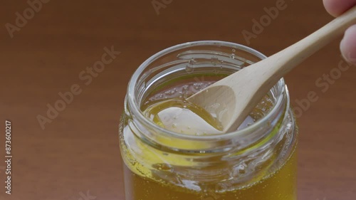 jar of honey and spoon