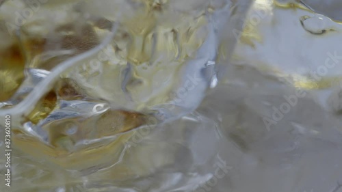 Coffee poured into a glass with ice