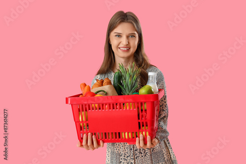 Young woman with full shopp...