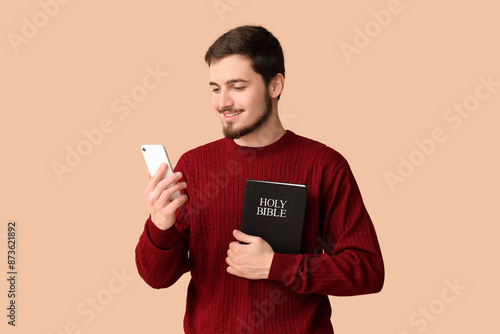 Religious young man with Ho...