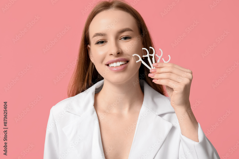 Young woman with toothpicks on pink background, closeup Young woman with toothpicks on pink background, closeup