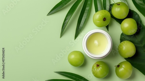 Amla Extract in a chic container, with amla fruits and leaves, on a vibrant natural backdrop, photorealistic and premium photo