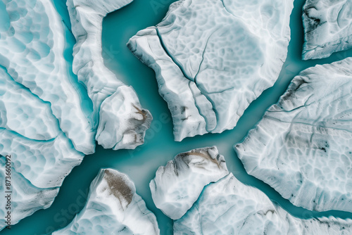 Wallpaper Mural Aerial photo of cracked icebergs floating in turquoise water. Captures the beauty and fragility of nature's frozen landscapes. Torontodigital.ca