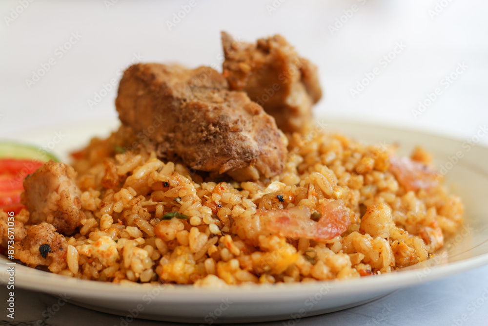 Close up image of nasi.goreng ( fried rice ) with pork. Delicious chinese indonesia food. Close up image of nasi.goreng ( fried rice ) with pork. Delicious chinese indonesia food.