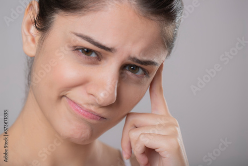 Close Up Image Shows A Shy Lady Getting Confused And Looking At The Camera