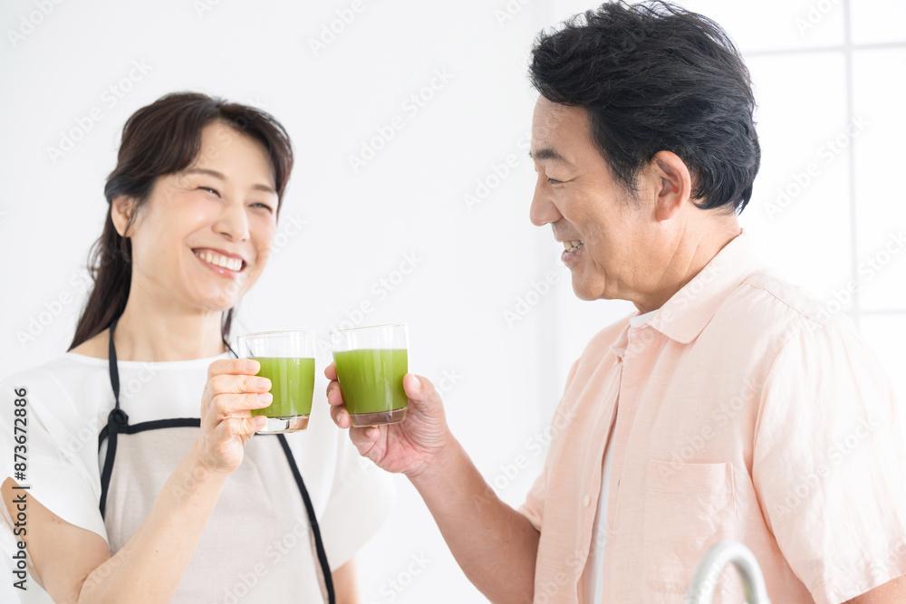 Health care image of a senior with a green juice (drink) in the kitchen, concerned about her health Close-up Health care image of a senior with a green juice (drink) in the kitchen, concerned about her health Close-up
