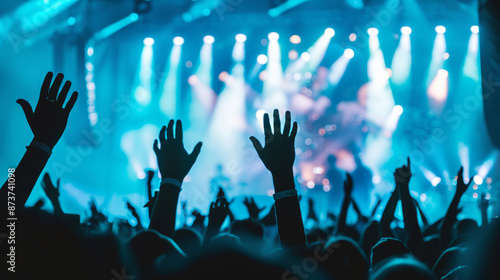 a professional photo of a music festival stage at nighttime from the back of the audience, with lights and sound