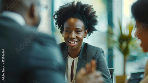Sleek Office Setting: Professional Consultants Advising Clients on Business Strategies in Collaborative Discussion