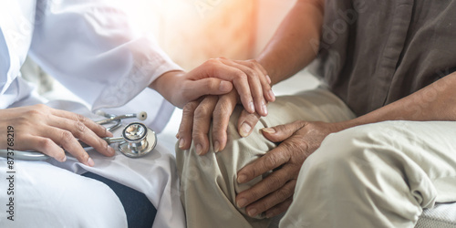 Arthritis or parkinson disease elderly patient, old aged senior woman holding geriatric doctor, cargiving nurse or family assistant's hand in hospice home for medical health care or mental therapy
