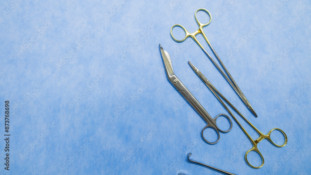 Fototapeta premium Stainless forceps medical scissors. Medical instruments. Medical Surgical Instrument. Equipment used in surgery.