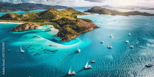 aerial view of the turquoise waters with white sand beaches and heart-shaped Hill Inlet, surrounded by sailing boats