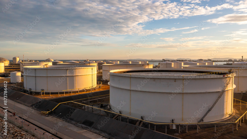 Aerial view oil and gas depot industrial facility for storage logistic petrochemical product, Crude oil and gas depot terminal storage tank petroleum petrochemical refinery product, Business energy. Aerial view oil and gas depot industrial facility for storage logistic petrochemical product, Crude oil and gas depot terminal storage tank petroleum petrochemical refinery product, Business energy.