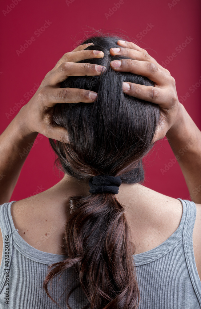 Naklejka premium Inclusivity shown by man’s hands on woman’s head