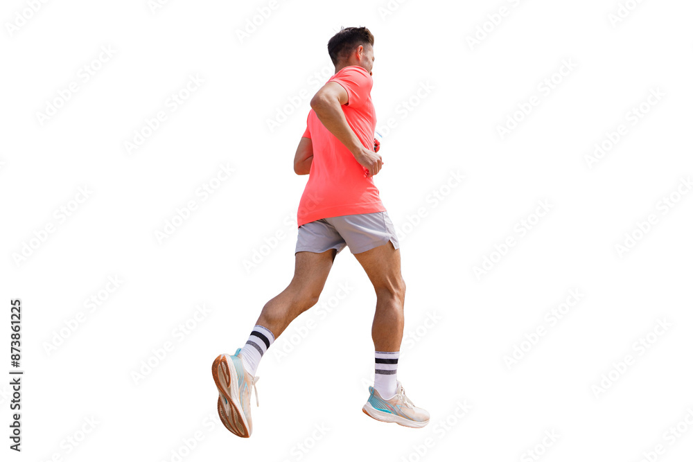 Obraz premium A male athlete is seen running in a sports uniform, engaged in training. The athlete is in the process of jogging and has cut out.