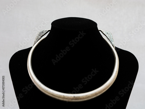 Handmade Hmong or Miao silver jewelry display on white background photo