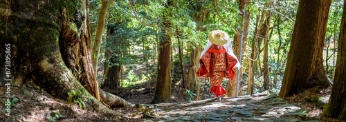 Japanese woman wearing traditional Heian Period costume at the Kumano Kodo Pilgrimage Route in Wakayama prefecture of Japan