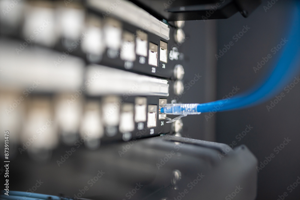 close up of network cables connected to server racks in data center room. close up of network cables connected to server racks in data center room.