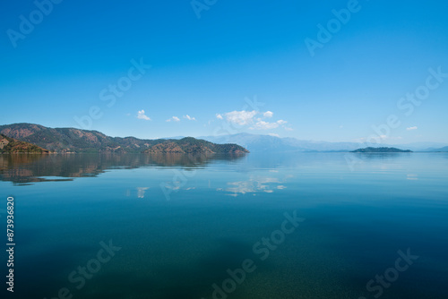 reflection of the forest in the lake.Bay views from green forests. View from the forest to the sea. Magnificent views from the forest to the sea. Magnificent bays of Muğla.