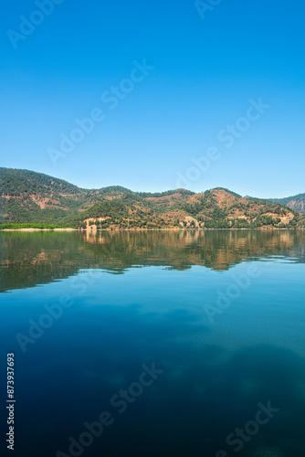 reflection of the forest in the lake.Bay views from green forests. View from the forest to the sea. Magnificent views from the forest to the sea. Magnificent bays of Muğla.