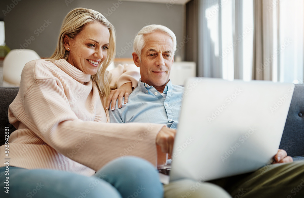 Sofa, happy and senior couple with laptop at home for trip planning, research and information. Woman, man and marriage with tech in living room for travel booking, decision and reading online reviews Sofa, happy and senior couple with laptop at home for trip planning, research and information. Woman, man and marriage with tech in living room for travel booking, decision and reading online reviews