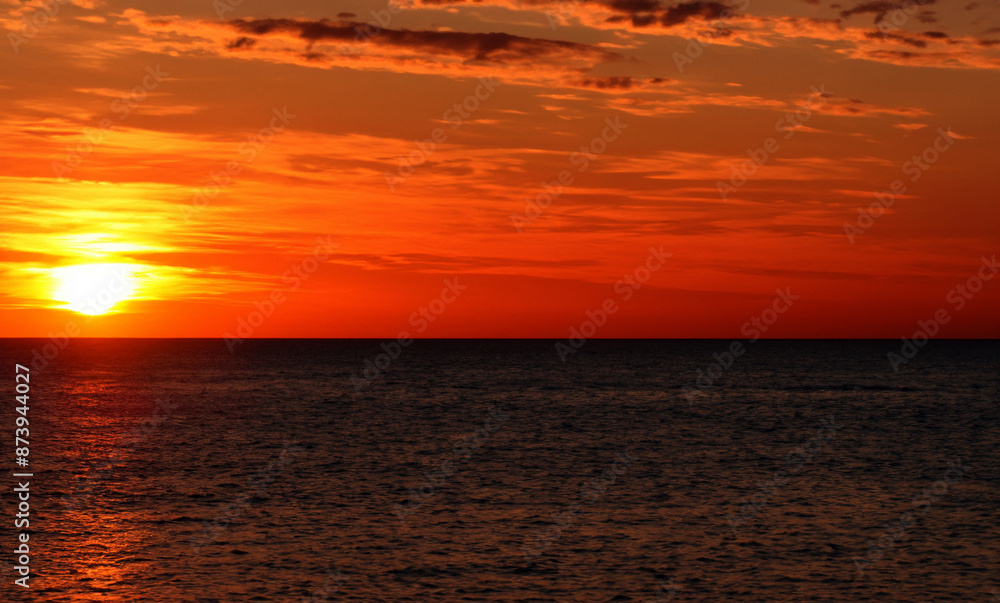 Fototapeta premium a beautiful sunset at sea on the island of Aruba generated with artificial intelligence