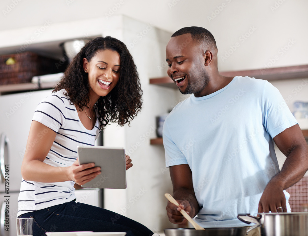 House, kitchen and couple with tablet for cooking, recipe website and instructions of food dish. Interracial marriage, man cook and woman with digital for online ingredients, browse and laugh in home House, kitchen and couple with tablet for cooking, recipe website and instructions of food dish. Interracial marriage, man cook and woman with digital for online ingredients, browse and laugh in home