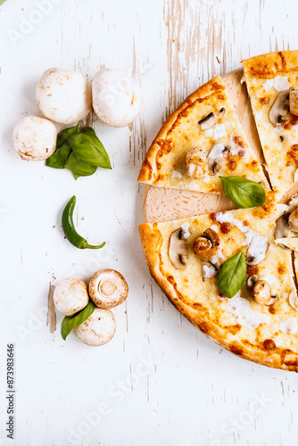 Tasty fresh baked pizza with champignons and chicken fillet