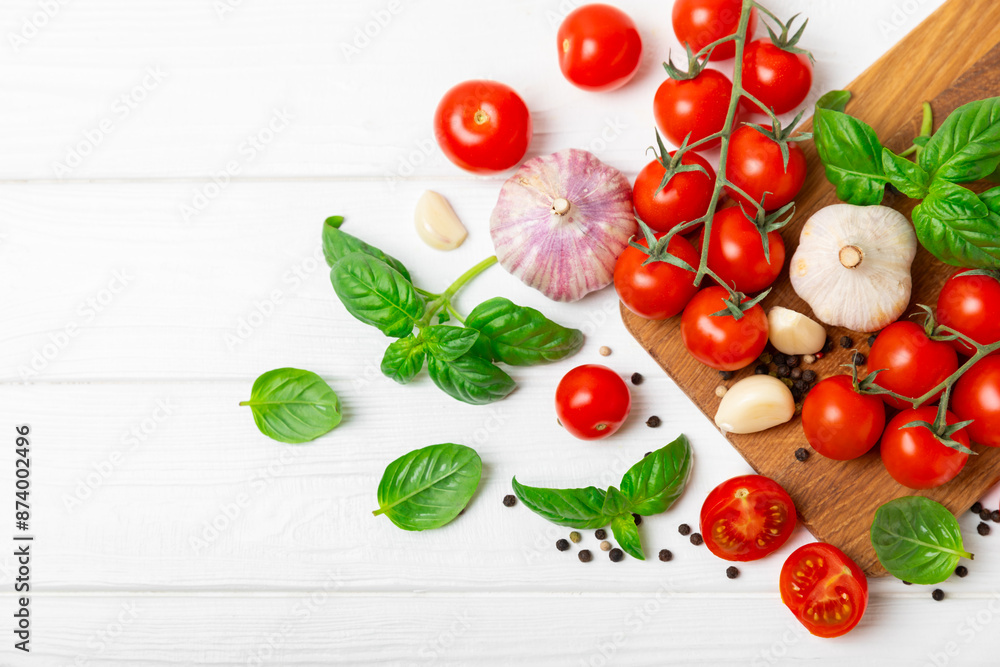 Fresh cherry tomatoes and fresh green basil on a textured background. Tomato sauce. Vegan. Ingredients for salad. Organic food. Place for text. Copy space. Fresh cherry tomatoes and fresh green basil on a textured background. Tomato sauce. Vegan. Ingredients for salad. Organic food. Place for text. Copy space.