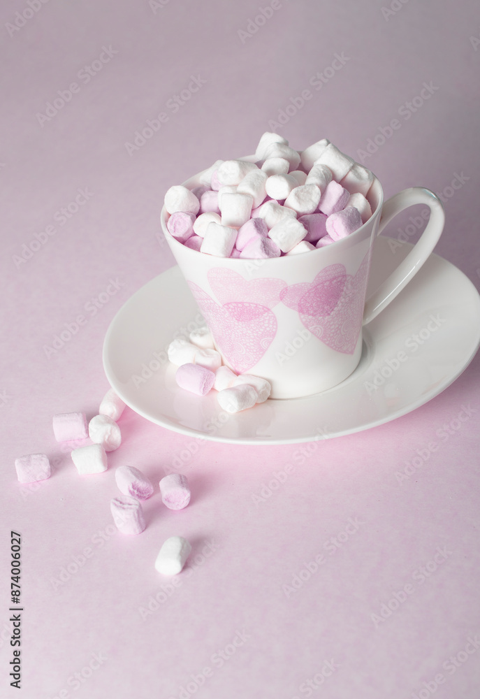 light pink and white marshmallows in a beautiful ceramic cups with pink hearts, Concept Mother's Day gift, Valentine's Day. High quality photo light pink and white marshmallows in a beautiful ceramic cups with pink hearts, Concept Mother's Day gift, Valentine's Day. High quality photo