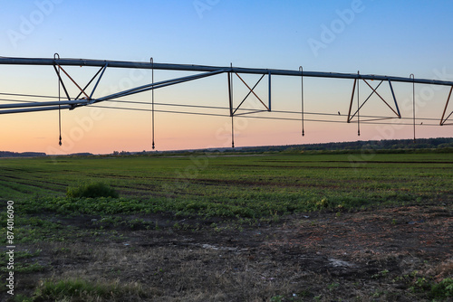 Field with mobile Irrigation system for water supply. Automatic field watering system.