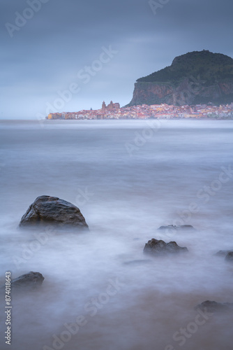 Cefalu beach at sunsrise Sicily Italy with long exposure photo