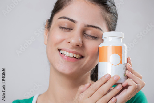 Indian Beautiful Model Holding Bottle Pill In Hand