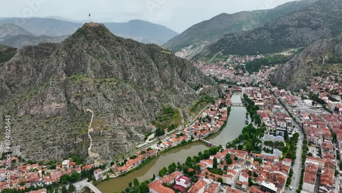 Fascinating view of the city of Amasya, also known as the city of princes. wonderful clouds coming out of the mountains. YESILIRMAK river. photo