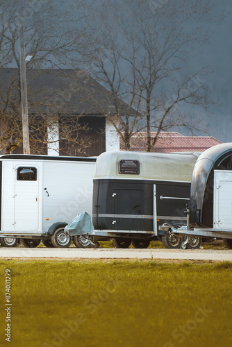 Horse Trailers Parked at the Farm Awaiting Their Next Trip photo