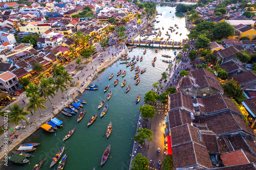 Aerial view of Hoi An Ancient Town with lantern boats on Hoai river, in Hoi An, Vietnam photo