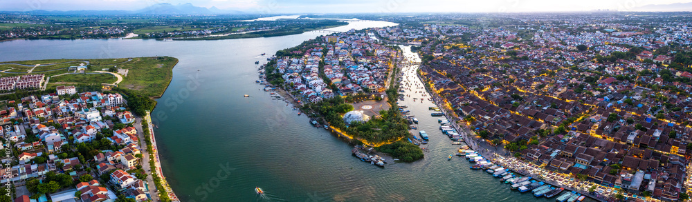 Fototapeta premium Aerial view of Hoi An Ancient Town with lantern boats on Hoai river, in Hoi An, Vietnam