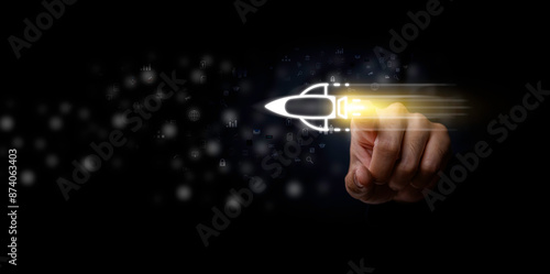 Obraz na płótnie Startup business concept, Businessman touch rocket virtual icon and fast start up business. Strategic planning and business success. Wealth fast, rising earning, increasing profits financial success. w salonie