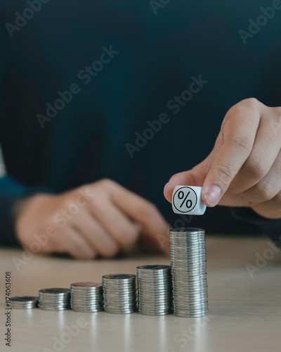Obraz na płótnie businessman stacking coins and percentage icon concept, money coins accounting for increase financial interest rate and business investment growth from dividend, Business Finance and Money. w salonie