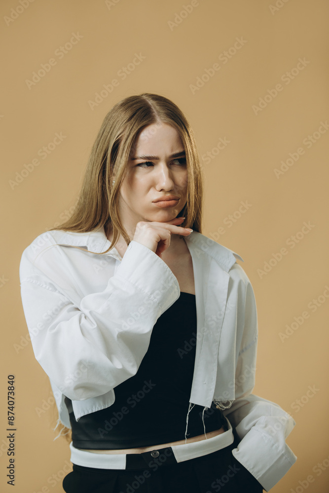 Portrait of thoughtful surprised girl pondering serious problems, looking with uncertain indecisive expression, making a choice. Portrait of thoughtful surprised girl pondering serious problems, looking with uncertain indecisive expression, making a choice.