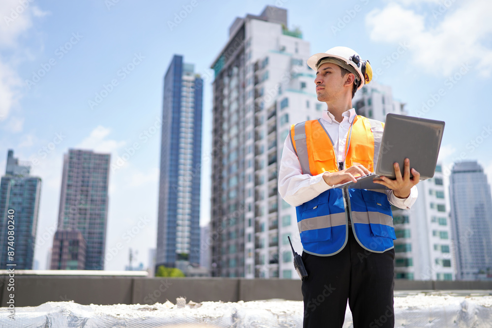 Engineer or worker working on laptop computer at construction site Engineer or worker working on laptop computer at construction site