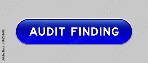Blue color capsule shape button with word audit finding on gray background