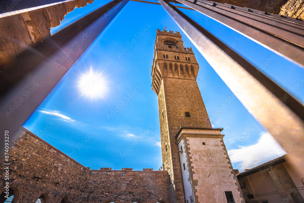 Florence. Palazzo Vecchio tower view through iron fence