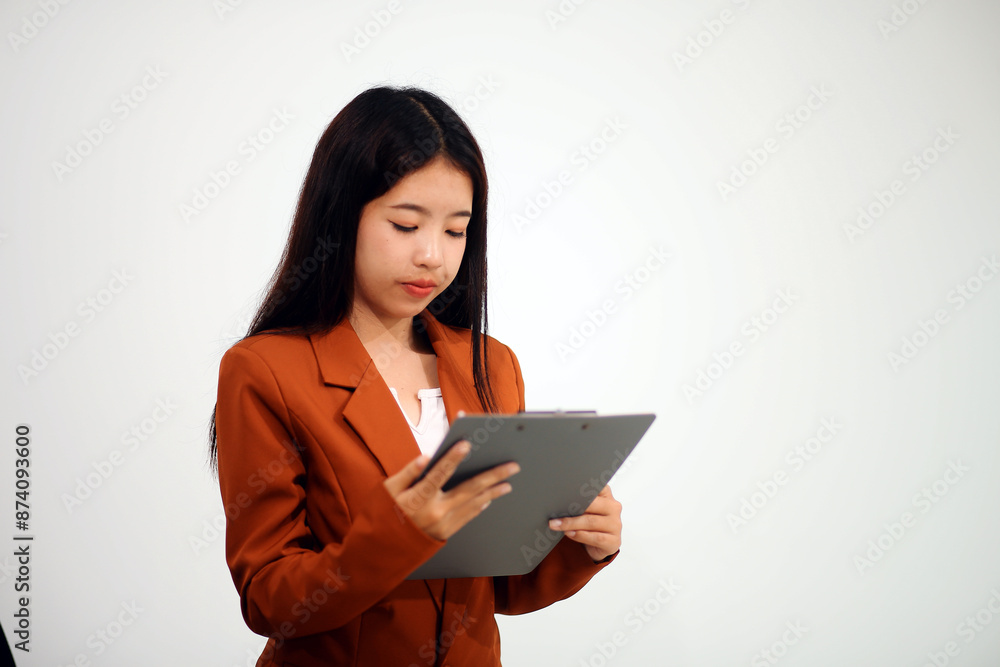 A driven and dedicated young professional showcases her efficiency and attention to detail as she works diligently on her laptop A driven and dedicated young professional showcases her efficiency and attention to detail as she works diligently on her laptop