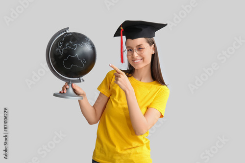 Young female graduate point...