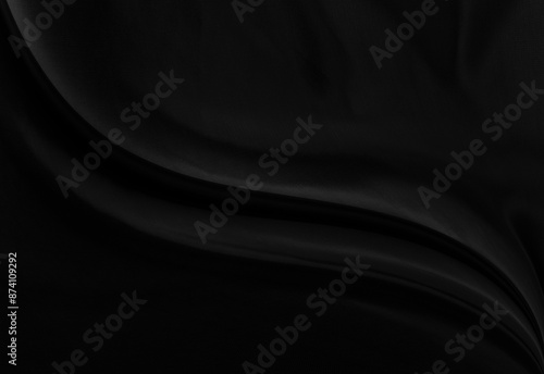 Black gray satin dark fabric texture luxurious shiny that is abstract silk cloth background with patterns soft waves blur beautiful. © Kamjana