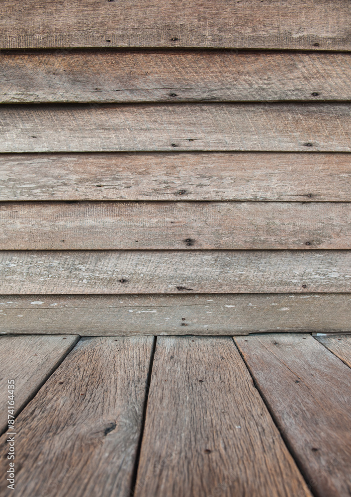Walls of an old wooden house are nailed together.